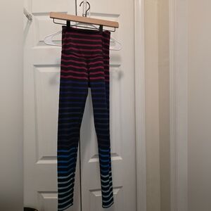 Beyond Yoga Striped Leggings in Pink, Purple, and Blue